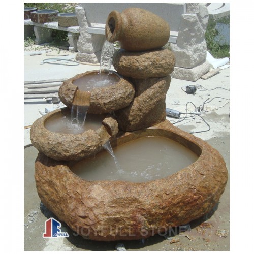 Carved stone waterfall fountain water feature