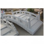 Carved Arched grey granite stone bridge with raillings