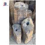 Rustic basalt pillar fountains